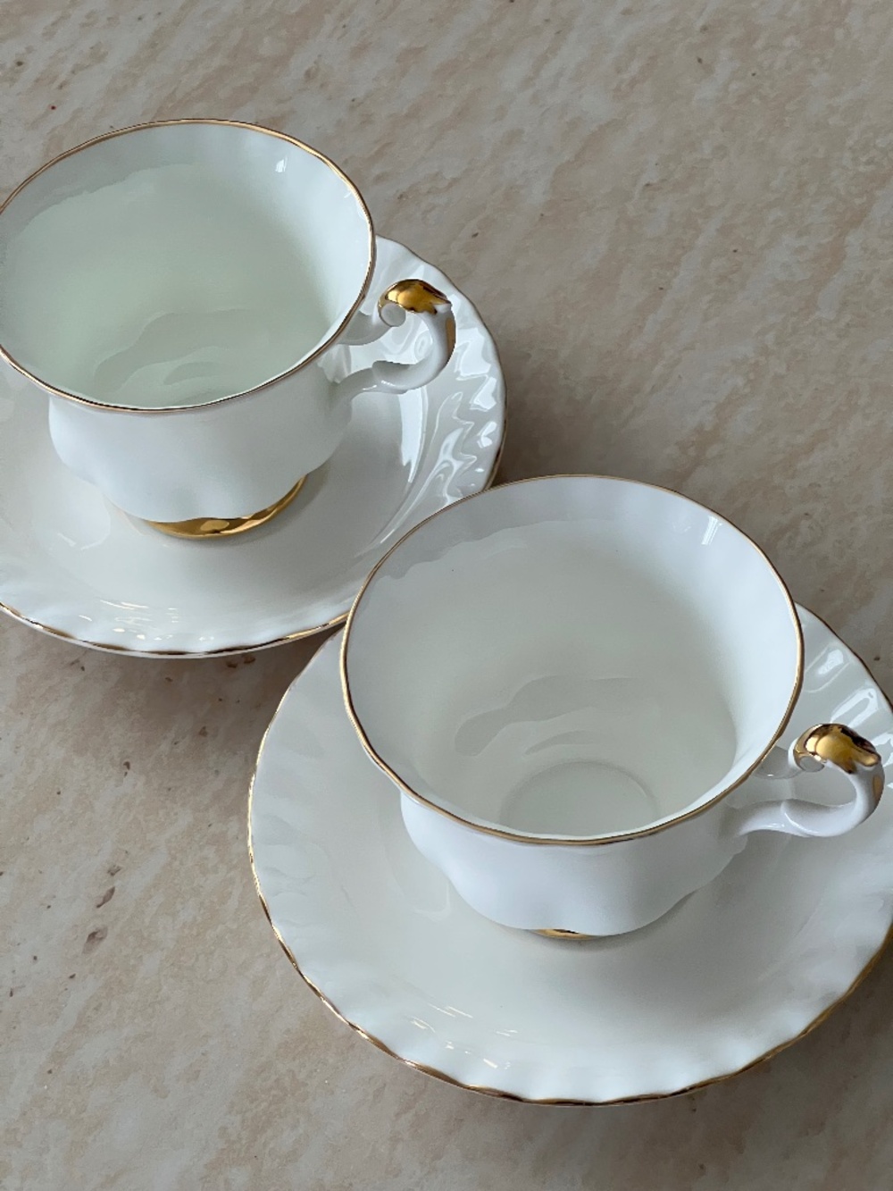 Set of two Royal Albert Val D’or teacups with saucers
